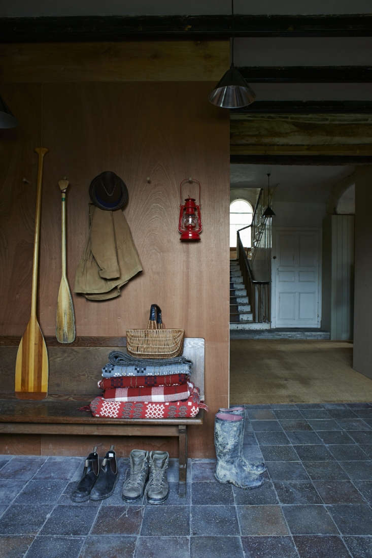 stacked woolen blankets in the mudroom at fforest: a former farm transform 28