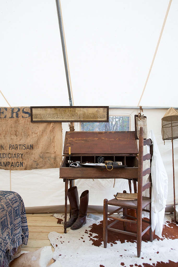 hermant and stanley outfitted the tent with an antique writing desk, ladde 19