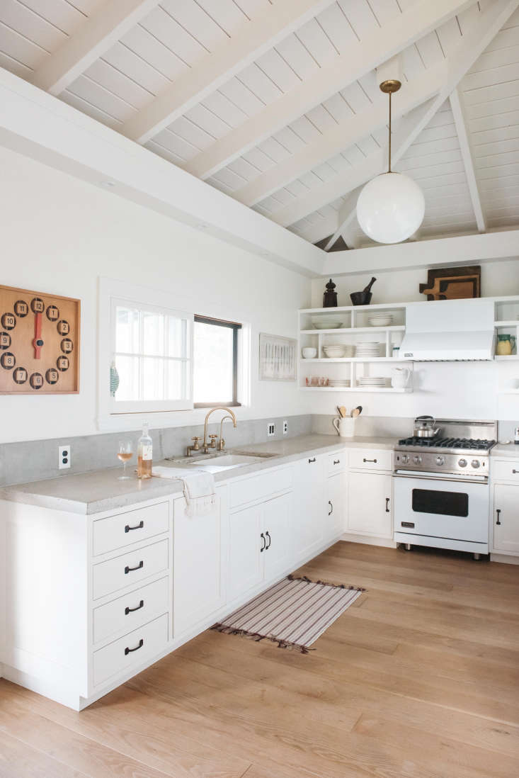 the pale gray counters and backsplash are poured concrete. photograph by kate h 19