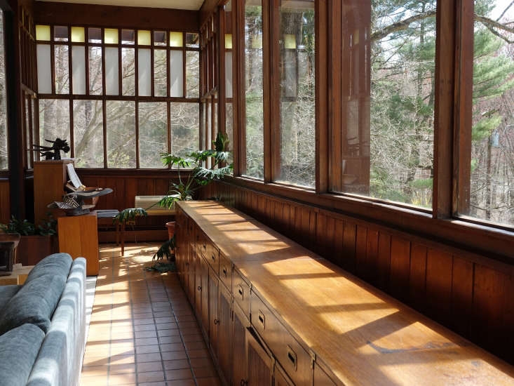 with its wall of eastern facing windows, the living room has a treehouse feel. 21