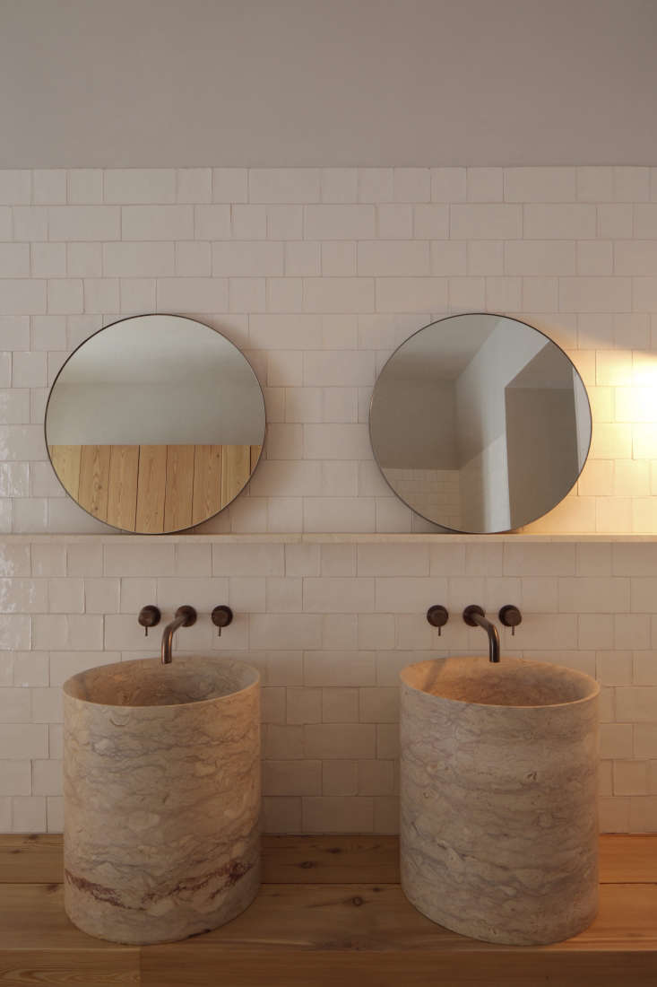 bathroom twin sinks round mirrors santa clara hotel portugal