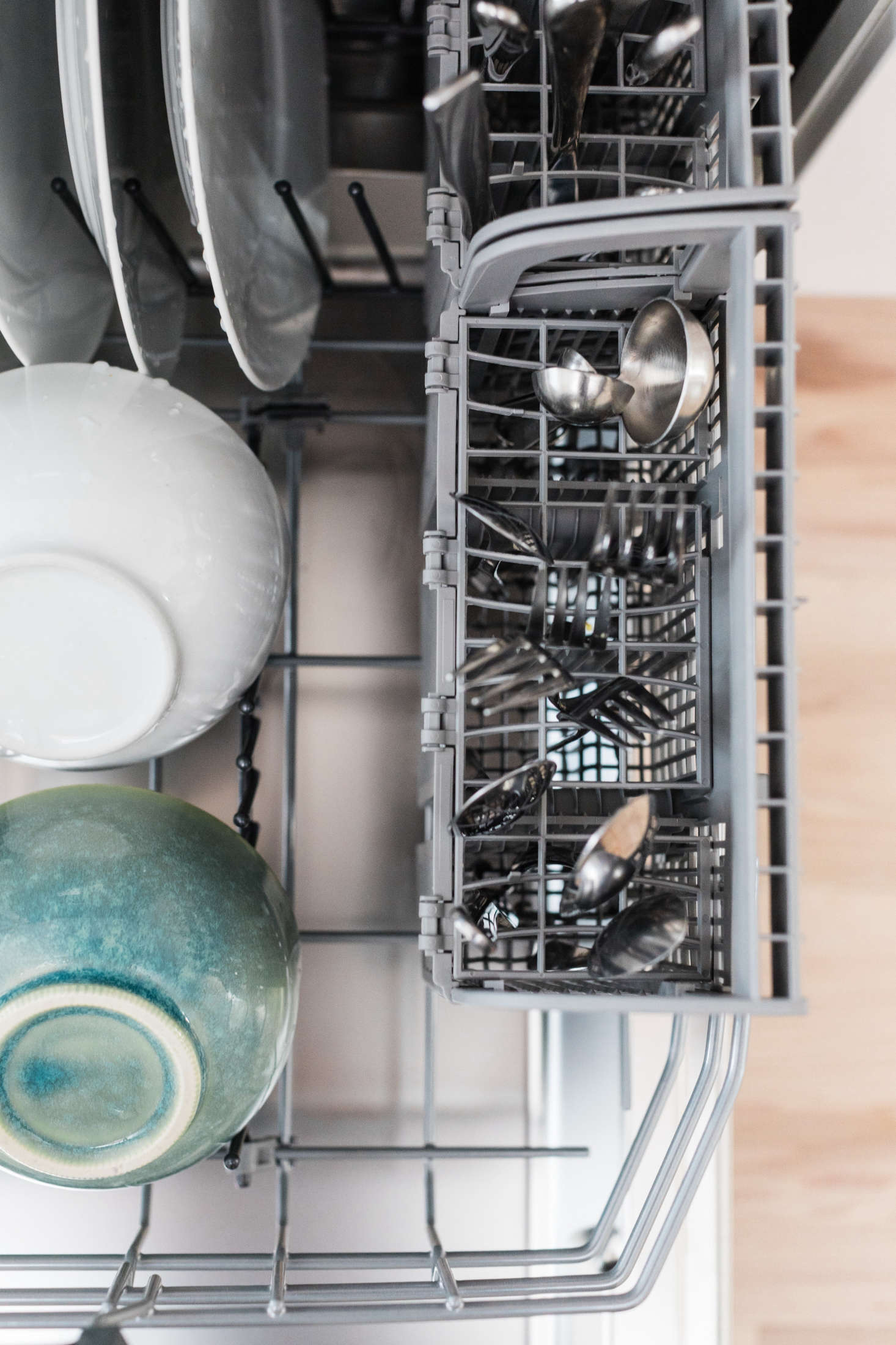 Bosch dishwashers have removable flatware compartments which can be placed along the side, or in the center, of the lower rack.