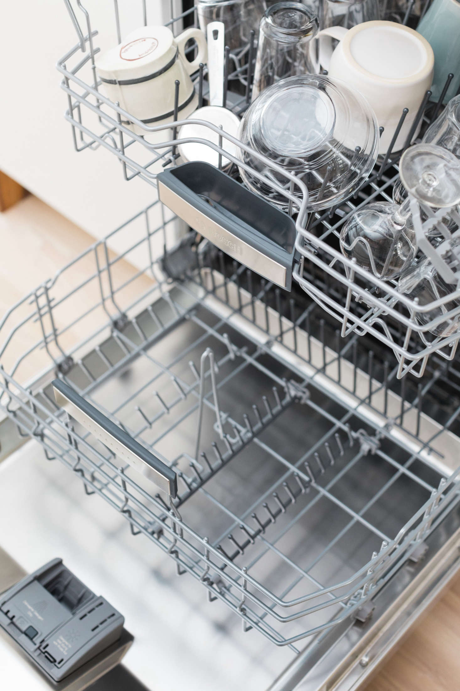 Water can pool on the bottom of cups and bowls on the top and middle racks. To avoid water drops from getting on the dry dishes below, unload the bottom rack first.