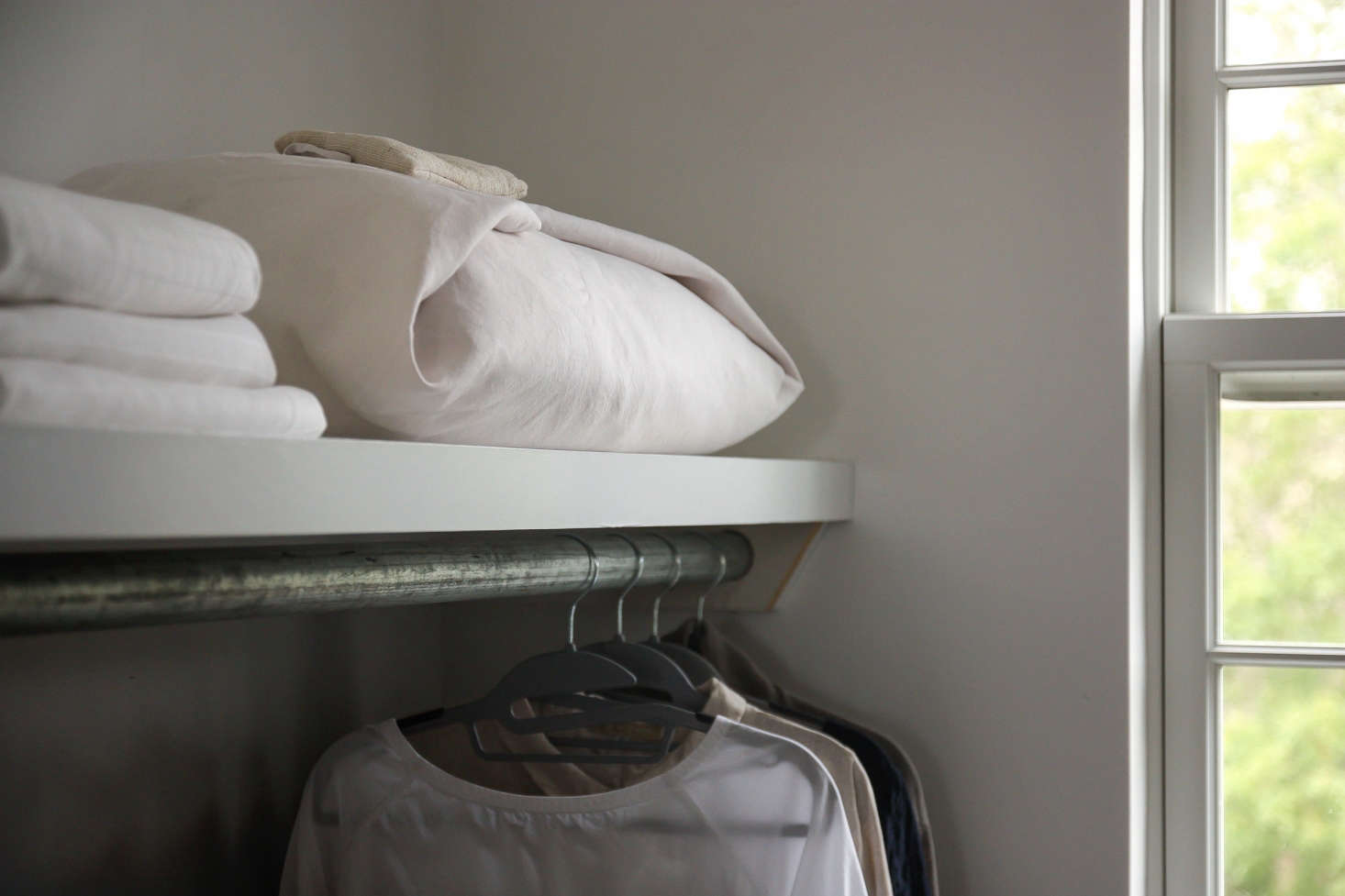 We stored an extra duvet wrapped in an old linen sheet, folded furoshiki-style.