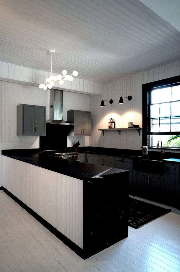 Why stop at one wall? Architect Kevin Greenberg created the ultimate loft kitchen with paneling on the walls and ceiling. (See Before and After: A Tuxedo Park Carriage House Gets an Update in Black and White.)