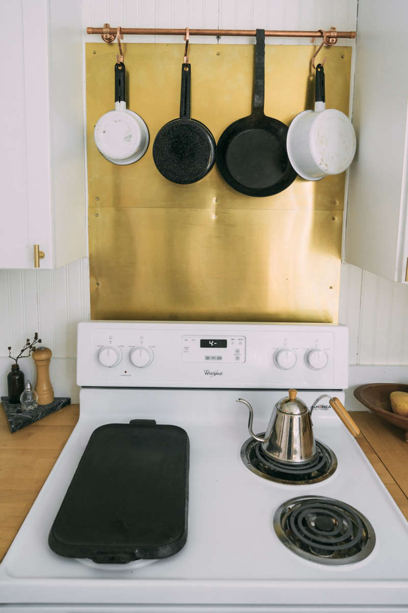 A simple DIY upgrade: a brass backsplash.