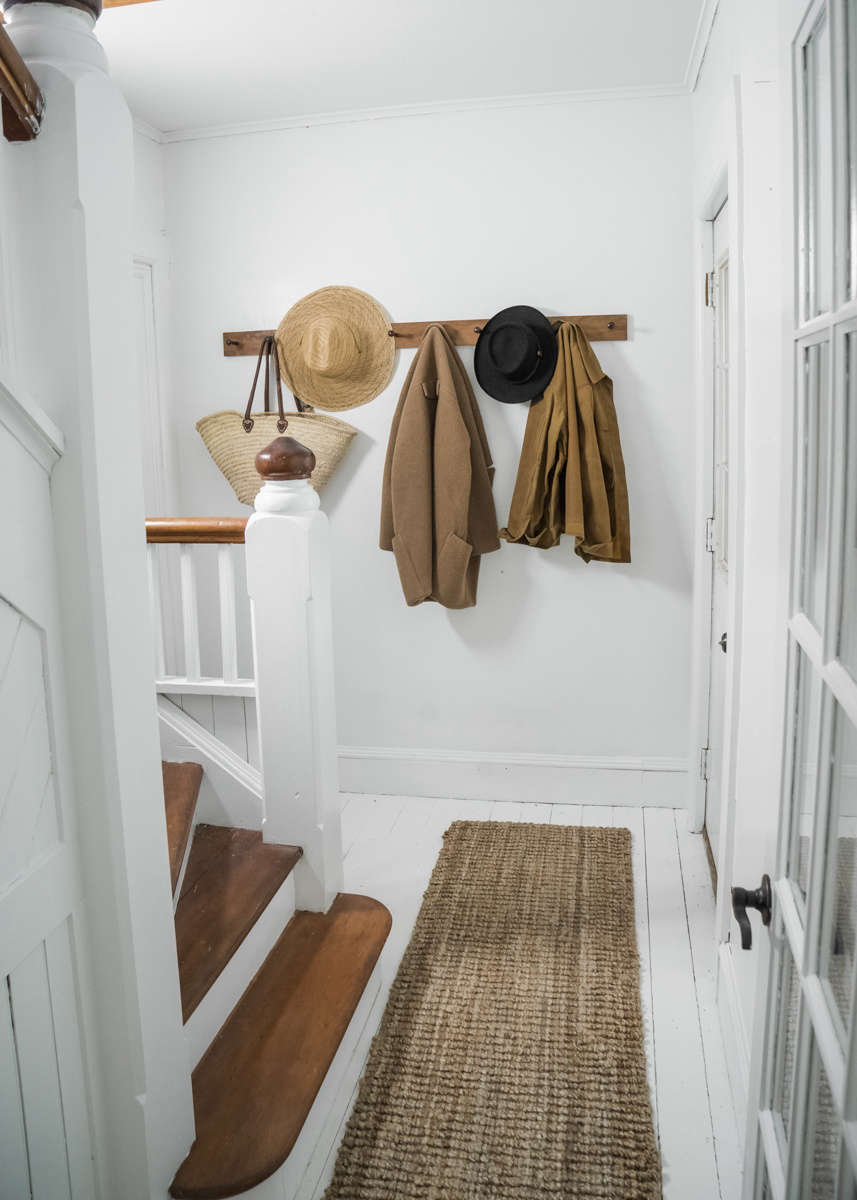 The sparse entryway has a peg rail from Peg & Rail. (See Object Lessons: The Shaker Peg Rail.)