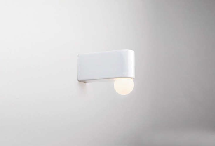 the white porcelain series wall d\2 light extends further out from the wall and 18