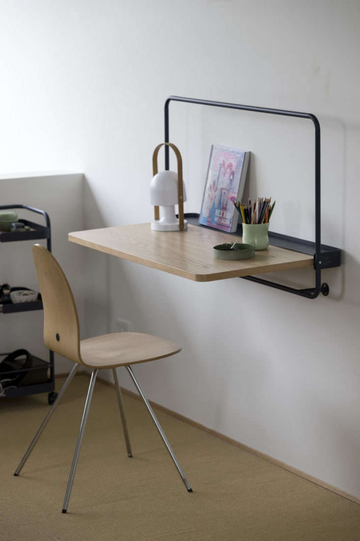 the wall table folds up when not in use. it comes in midnight blue (s 22