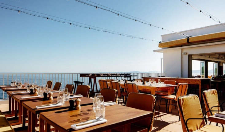 the outdoor dining terrace, strung with globe lights. 32