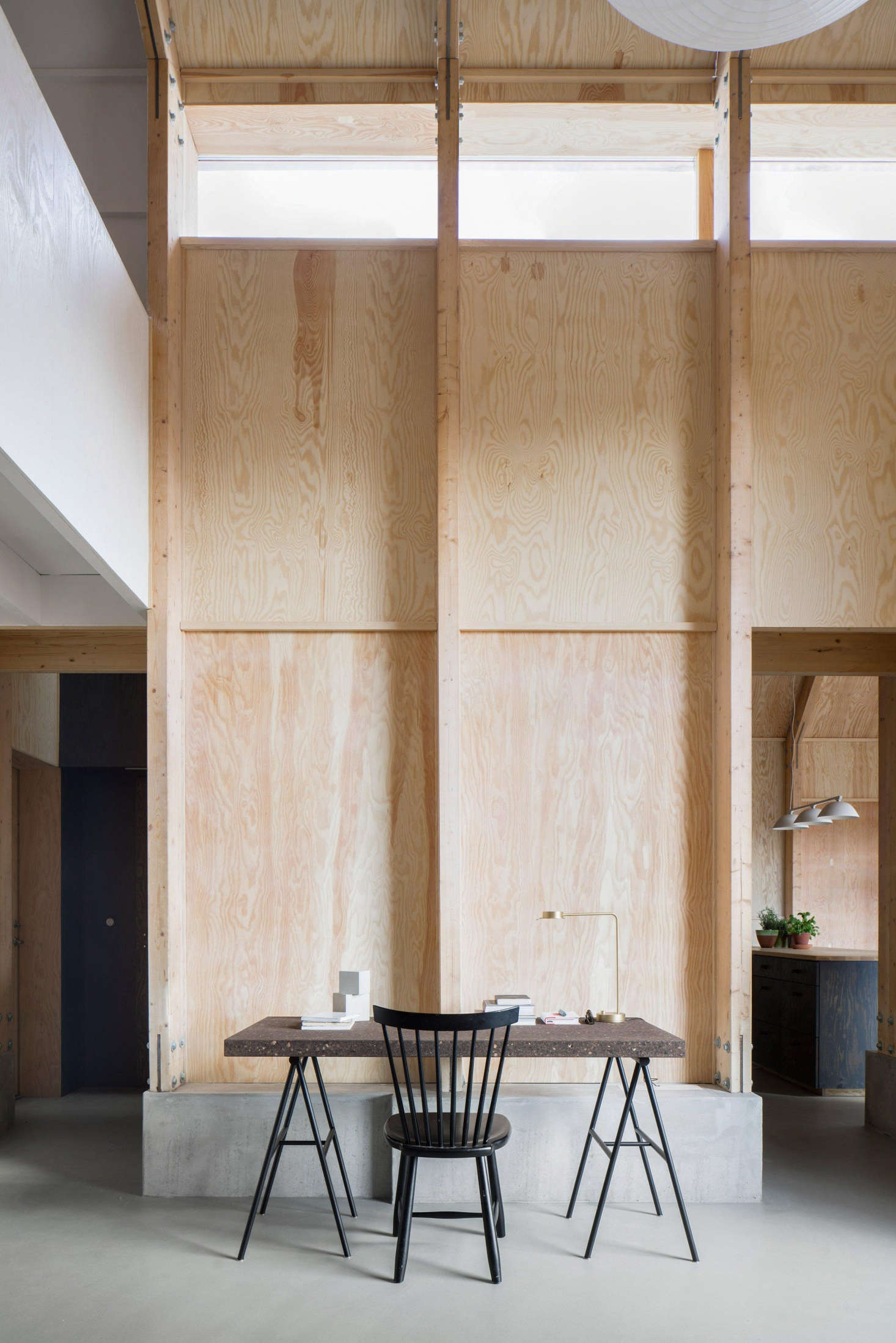 An expansive plywood wall in Förstberg Ling
