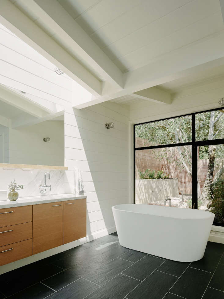 master bathroom slate floors private garden white bathtub malcolm davis