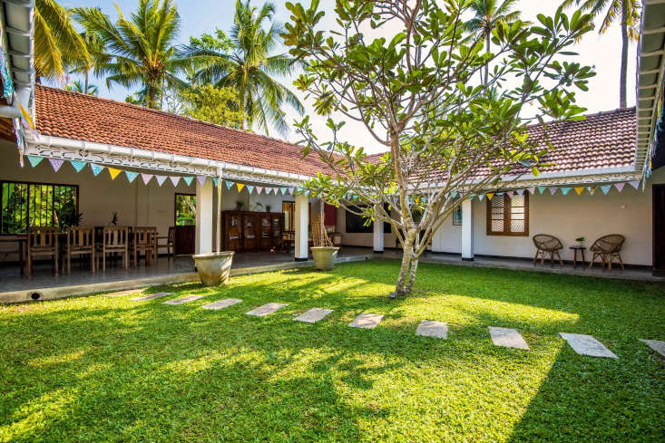 the villa is built around a grassy courtyard with a frangipani tree and has ope 28