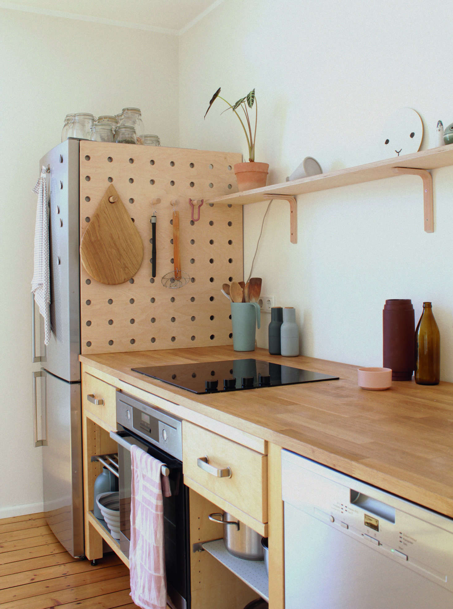 In the German kitchen of illustrator and graphic designer Swantje Hindrichsen, a pegboard hides the gap behind the fridge, which wasn’t deep enough to meet the wall. See more in Kitchen of the Week: An Artful Kitchen Created from Reclaimed Ikea Parts, Extreme Budget Edition.