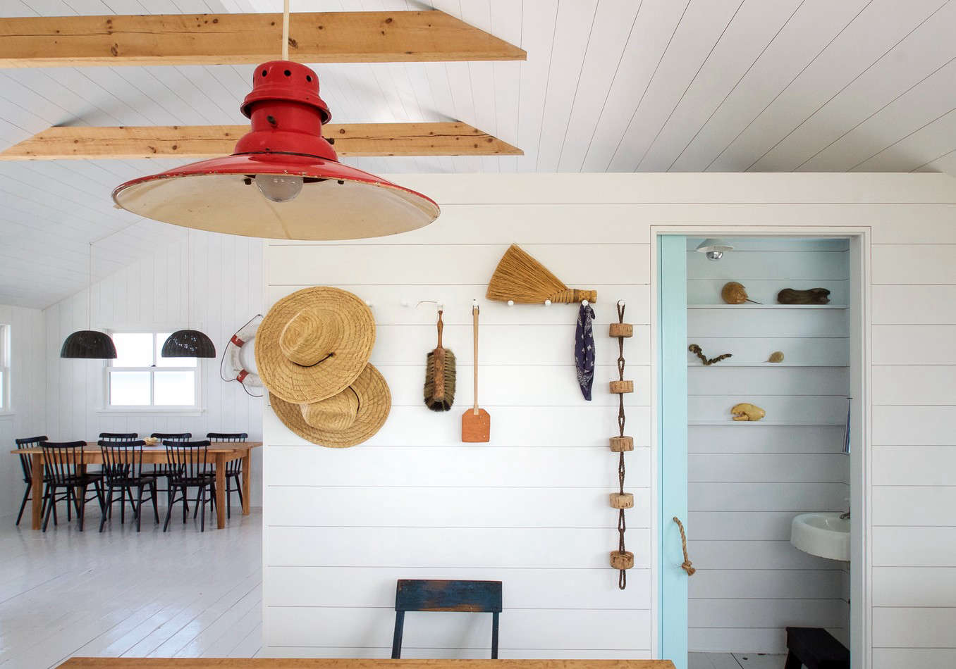 The interior is essentially one large room; a small bath is located off the entry, and two bunk rooms are partitioned off the main living space.