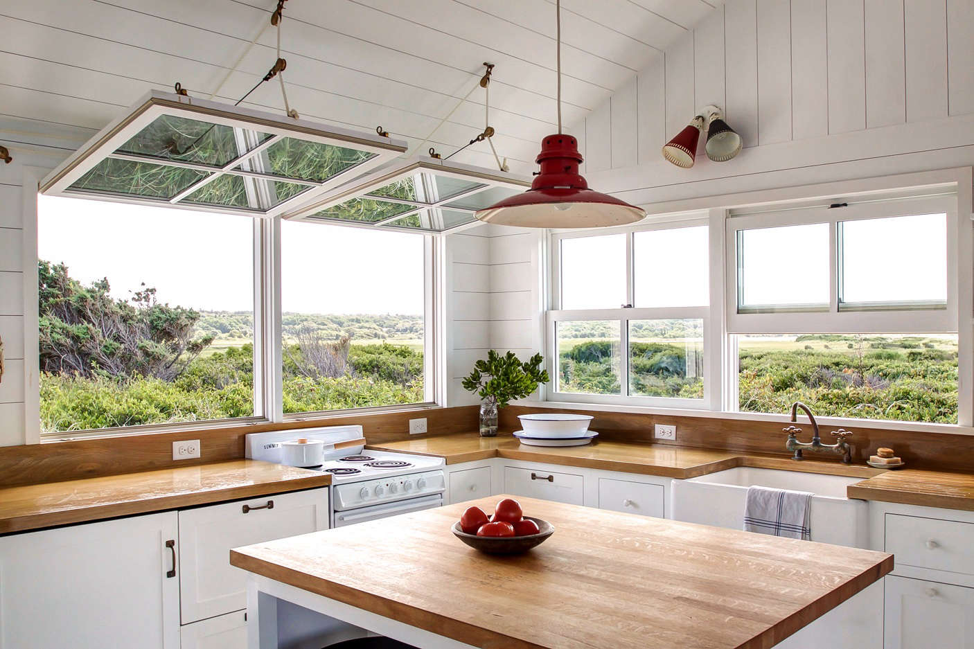 The reconfigured kitchen overlooks the Great Sippewissett Marsh, a protected tidal salt marsh.