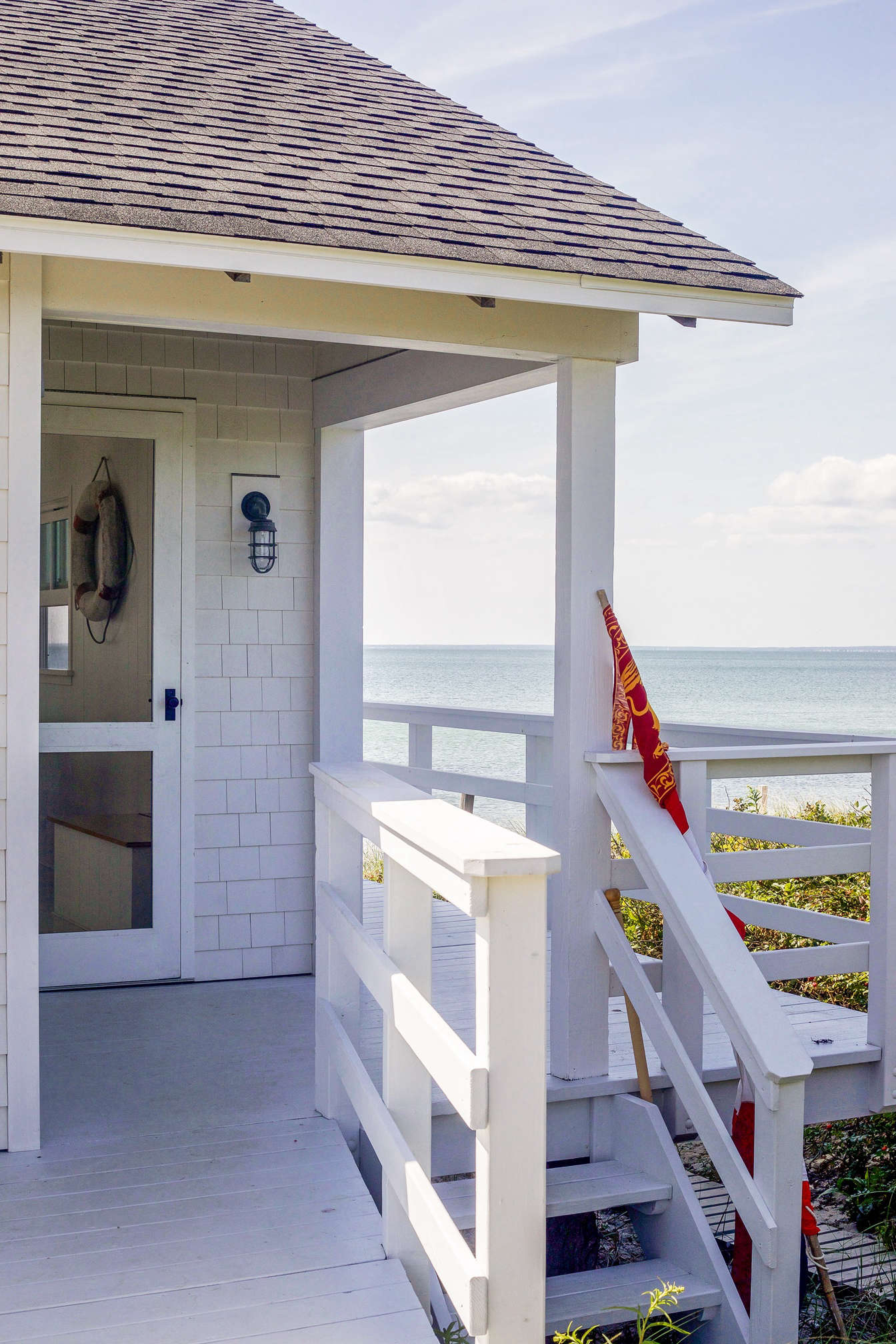 A view of the side door and wraparound deck.