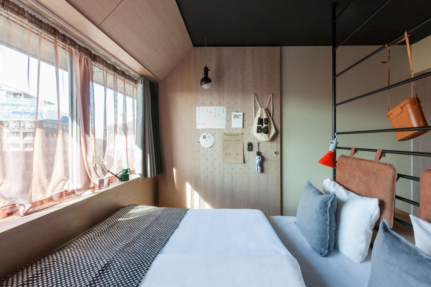 A floating furniture arrangement allows a tiny space to be put to multiple uses without feeling crammed. To make the most of the views and allow space for desks, the designers at Studio Aisslinger