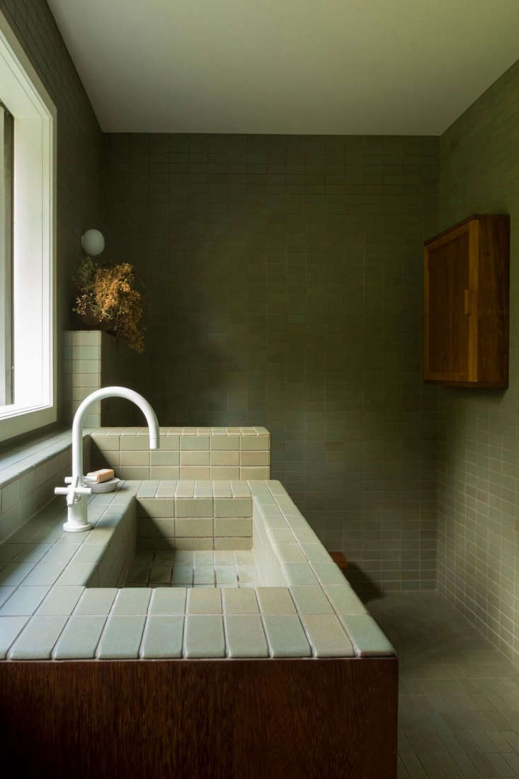 the second bath is a variation on the green theme and has a different layout. 21