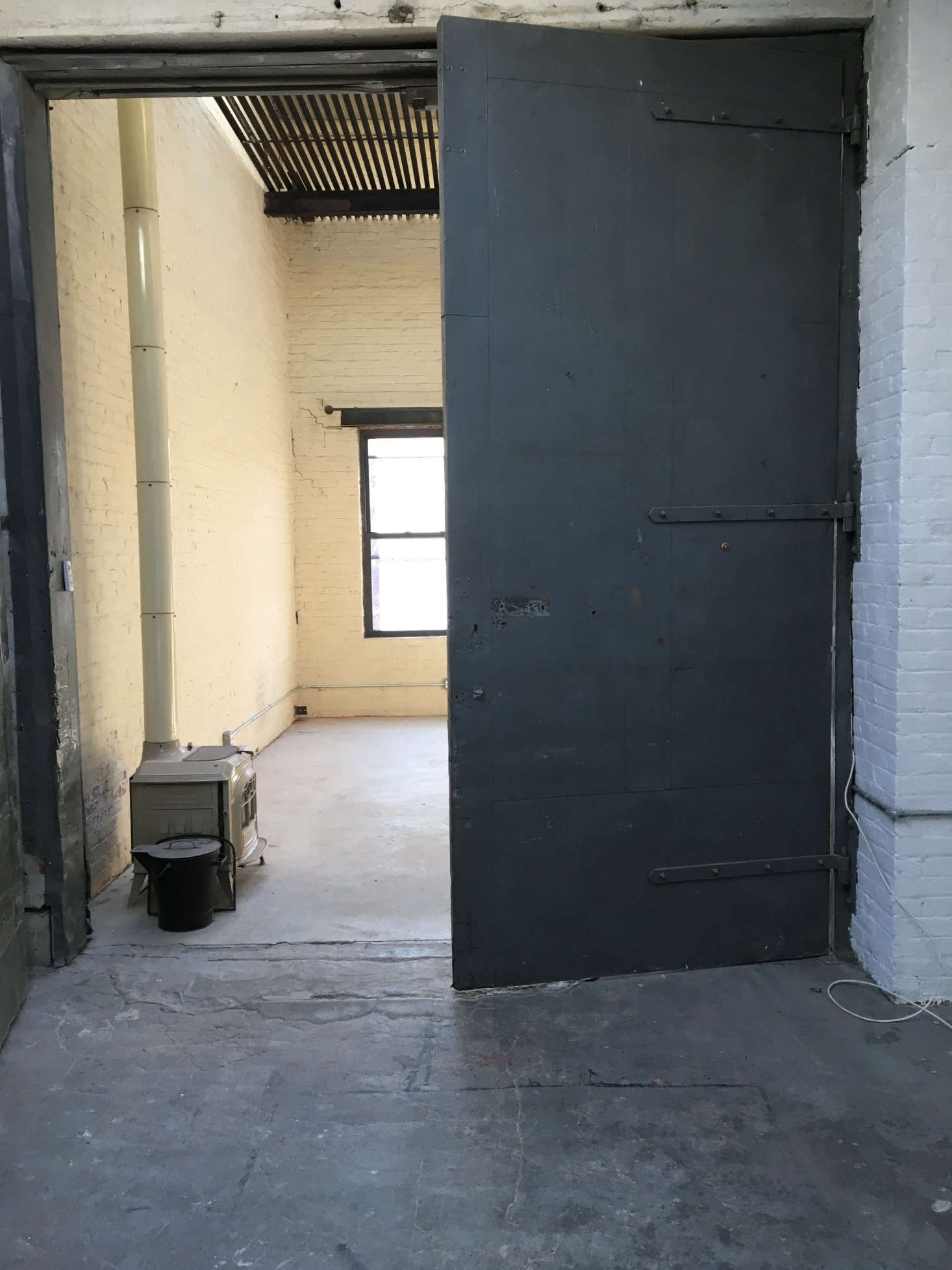 The freight elevator turned dining room, before. Photograph courtesy of Cook Space.