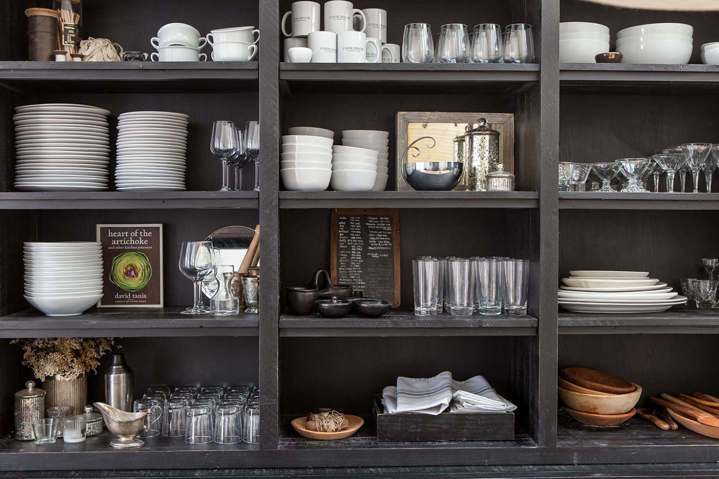 A black hutch (from Restoration Hardware) and open shelving displays dinnerware.