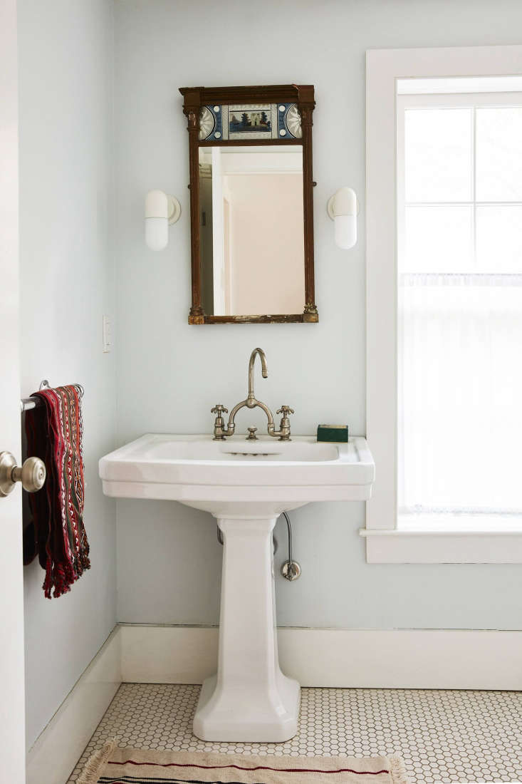 valentin outfitted the bathroom (pre renovation) with an antique mirror sourced 32