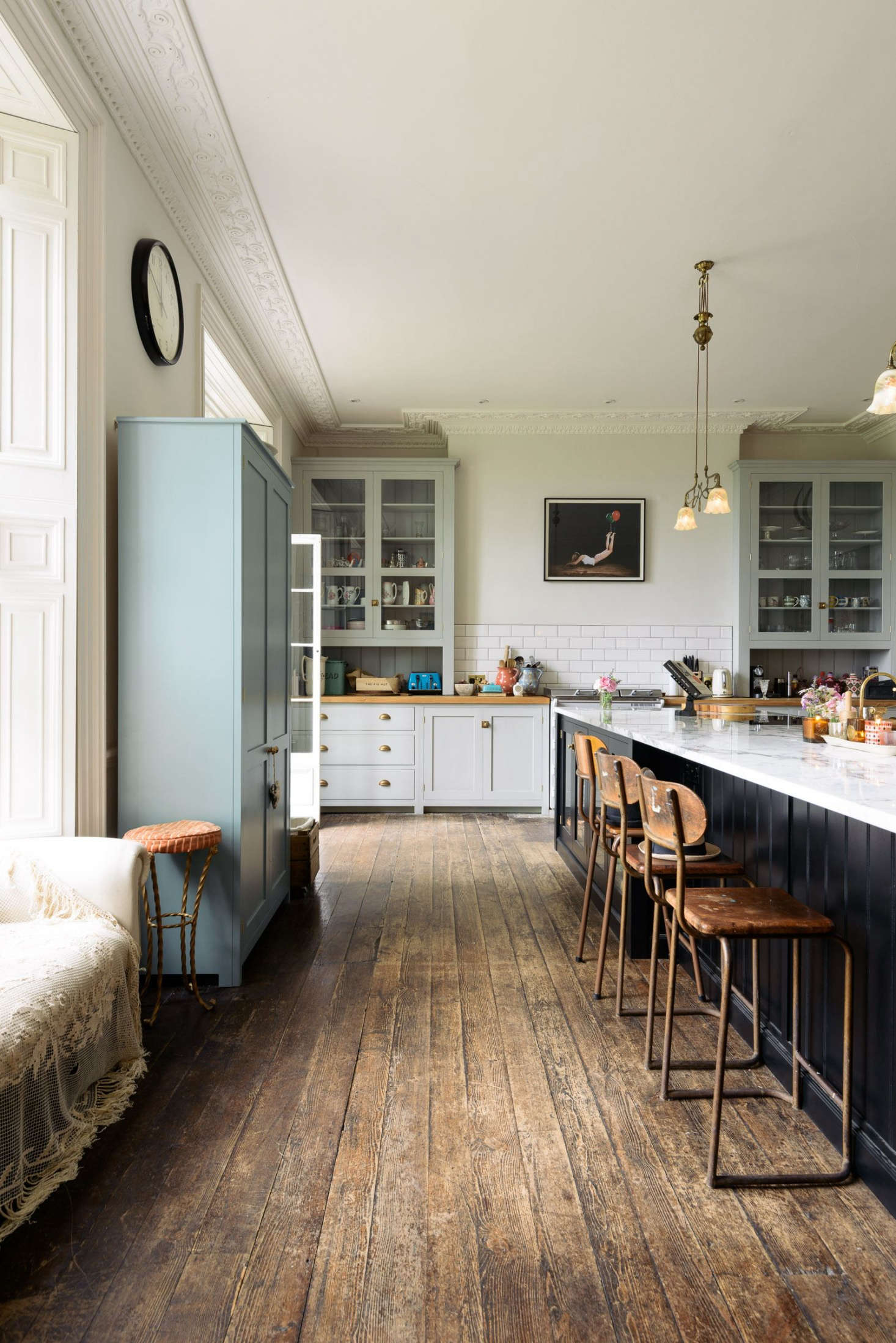 The floors are original to the country house, and the walls are painted in Farrow & Ball