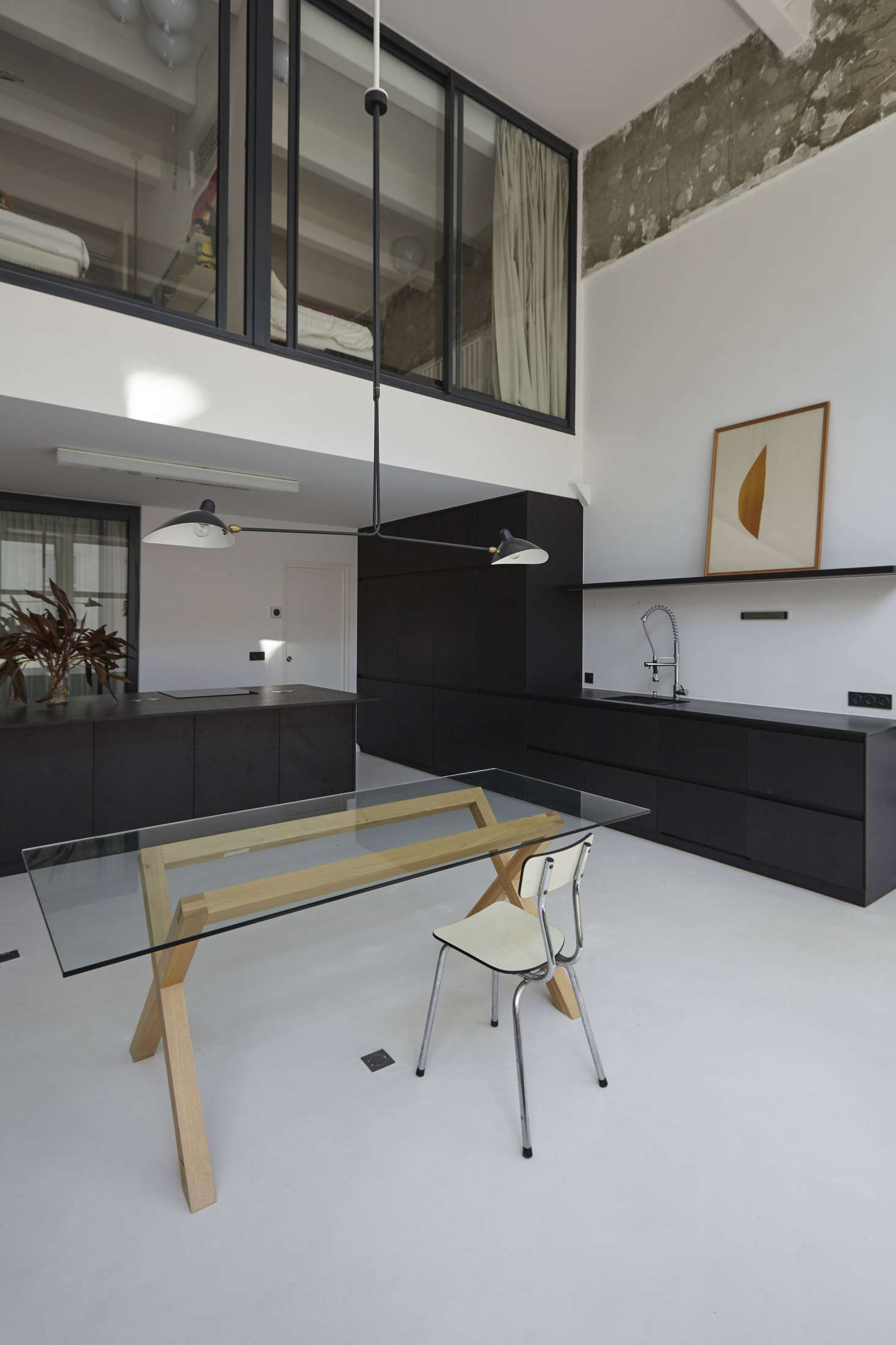 A slim-lined, vintage version at the table in a former factory building in Paris, remodeled by architect Nicholas Sisto. For a full look at the project, see A Renovated Loft in Paris by a Young Architect on the Up.