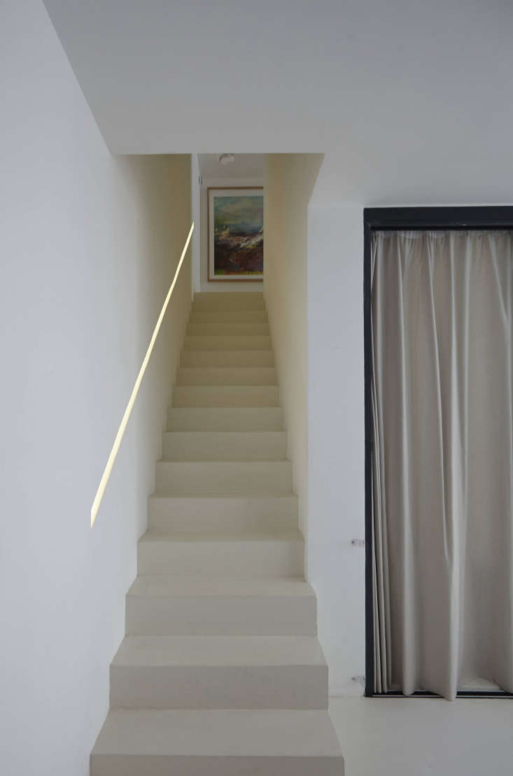 the studio created an inset banister and installed a string of led lighting wit 27