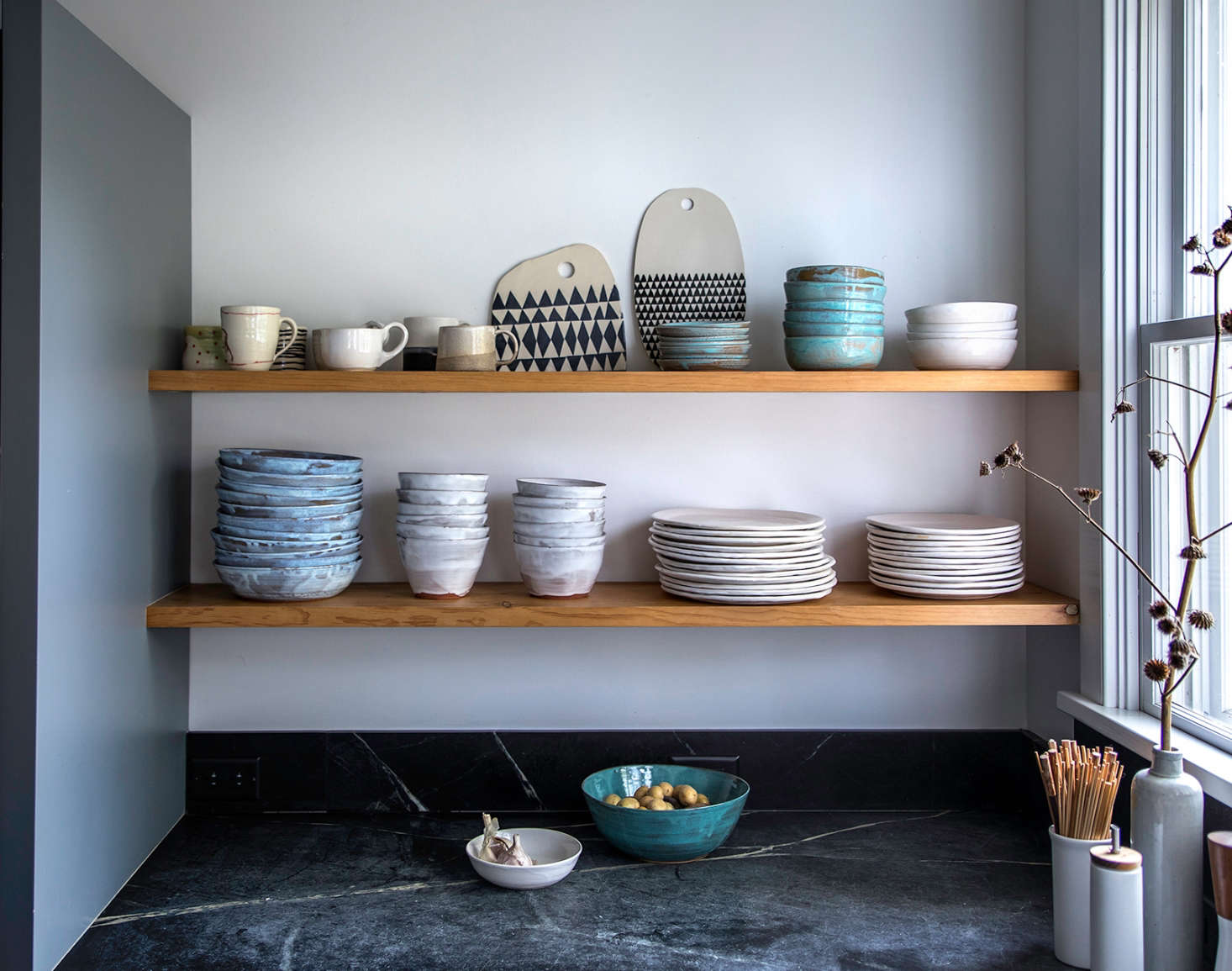 Open shelving holds Dunja