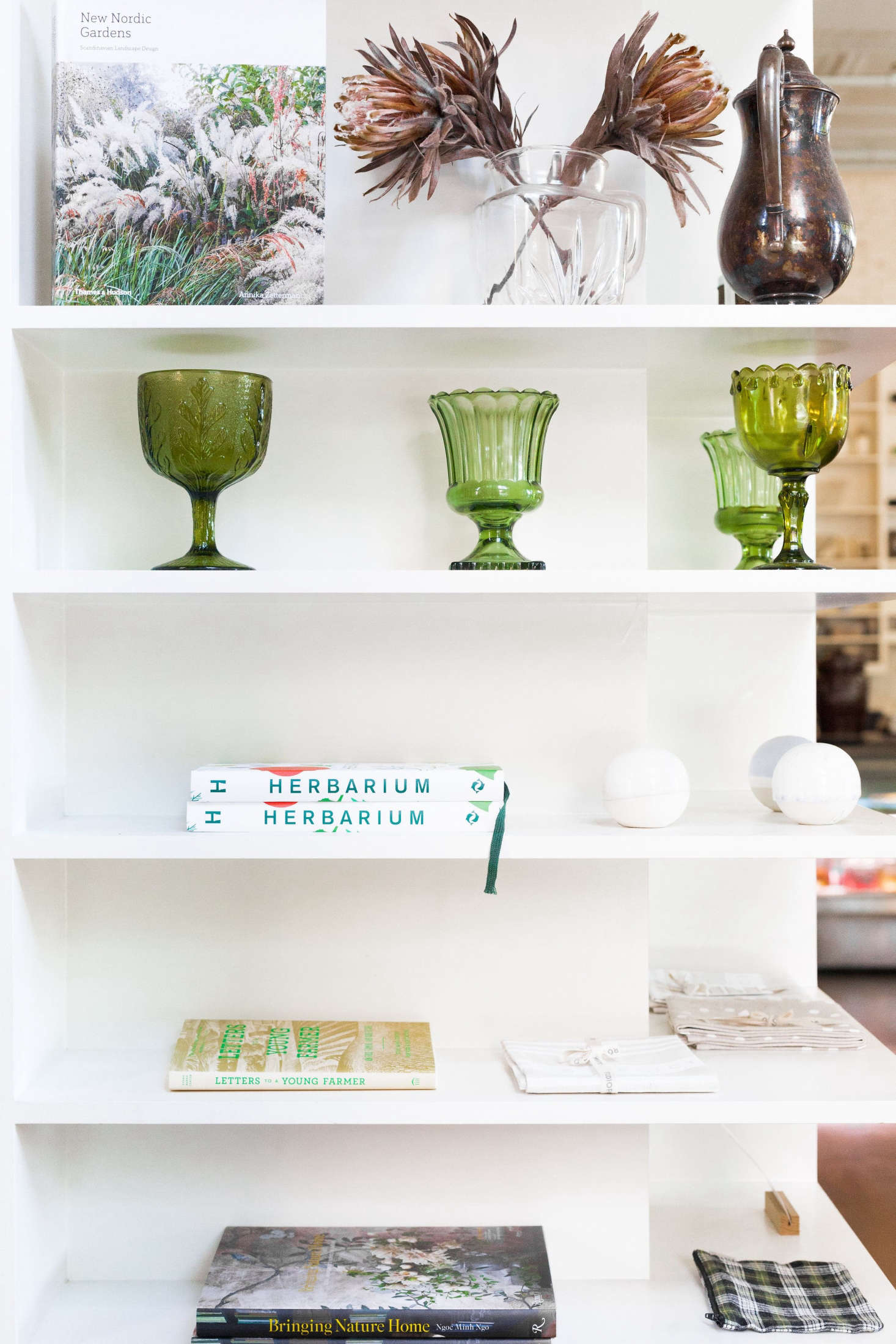 A small retail section offers books, ceramics, linens, and locally made larder goods such as honey and jam.