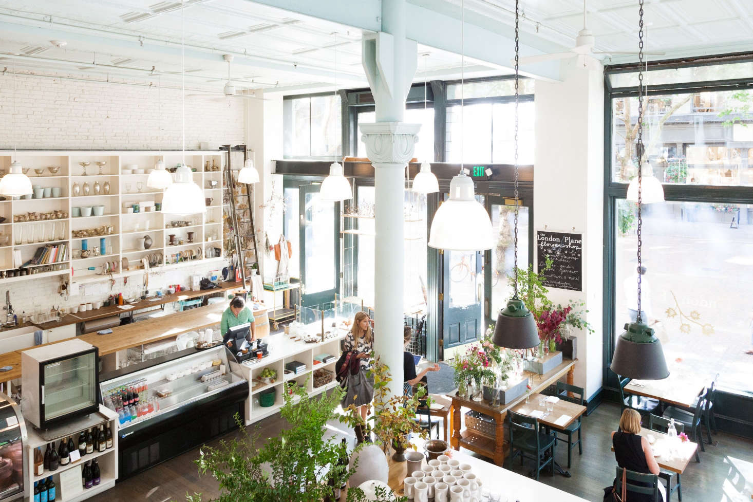 The London Plane is a multifaceted place: a sit-down restaurant plus flower studio with bar, takeaway, retail, and choose-your-own bouquet stand.