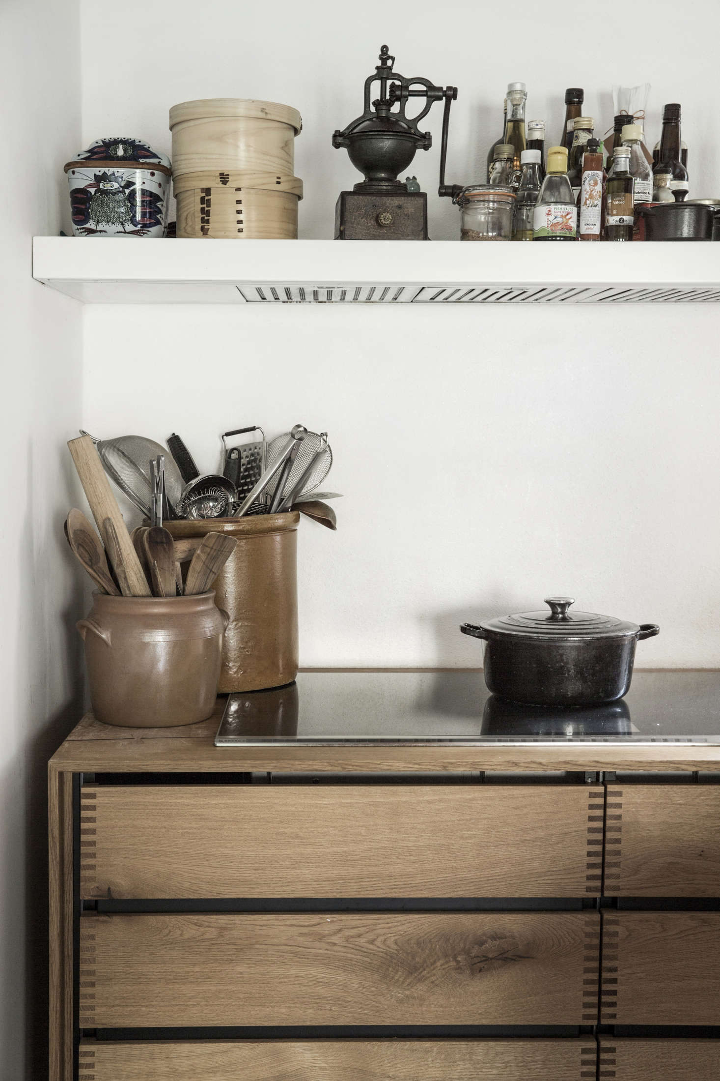 Large ceramic pots hold much-reached-for kitchen tools. Photograph courtesy of Dinesen.