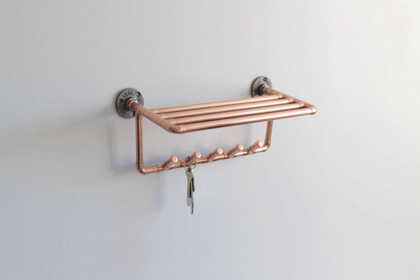 From the Copper Works on Etsy, the Copper Coat Hook Shelf is $60.69.