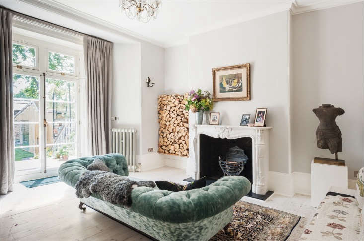 a neatly stacked wood pile next to the fireplace mantel at michelle mckenna& 20