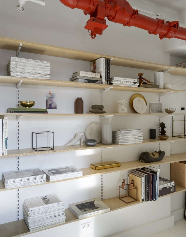 plywood shelves built from hardware store parts display not only books and maga 29