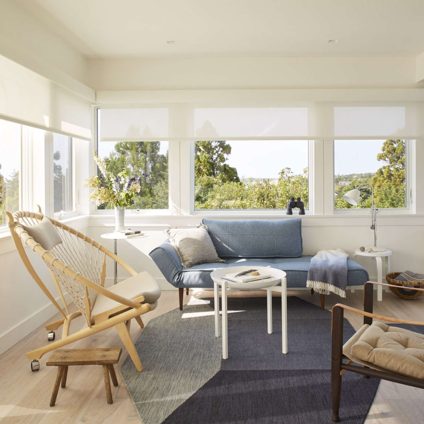 At one end of the living room, a drop-down sofa from the Danish Design Store converts into a single bed for extra guests.