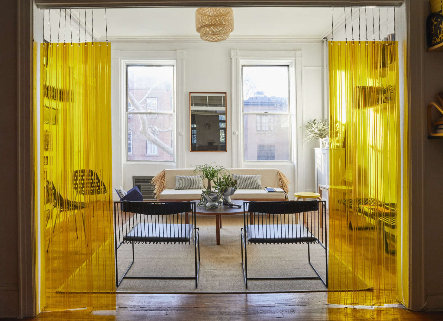 Hide an unappealing light fixture with a more attractive shade that will cover the whole thing. Here, designer C. S. Valentin used Ikea’s Sinnerlig Bamboo Shade to cover up an unsightly fixture; see At Home with C. S. Valentin: French Eclecticism in Cobble Hill, Brooklyn for more.