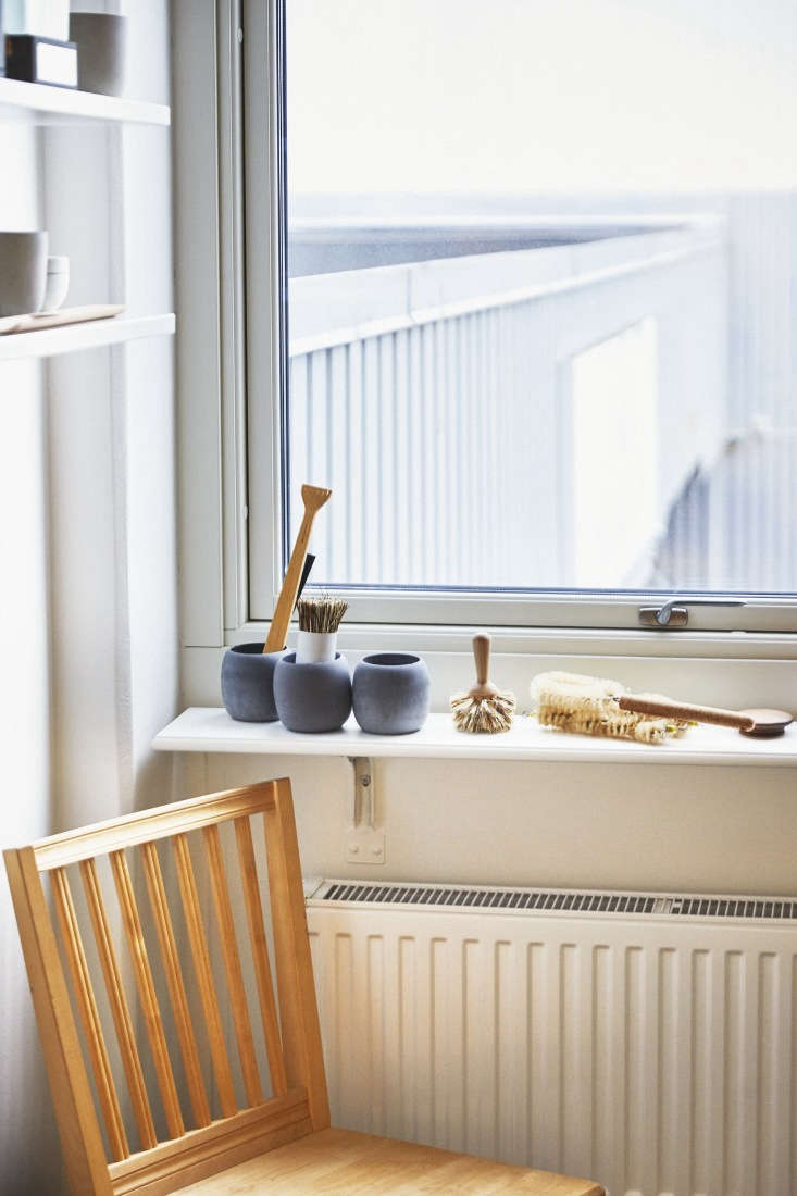 on the windowsill, a trio of soft concrete grey bowls designed for the bathroom. 26