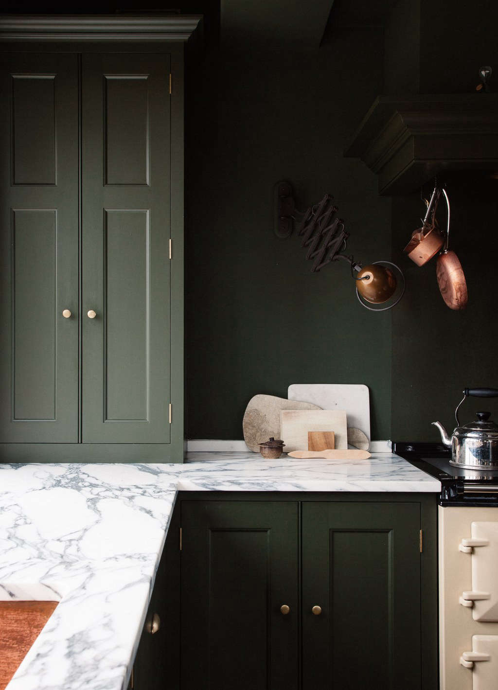 The centerpiece of the space: a vintage-style, oil-fueled Aga range in a cream color. (See Design Sleuth: Classic Aga Cookers.) In keeping with the homeowners
