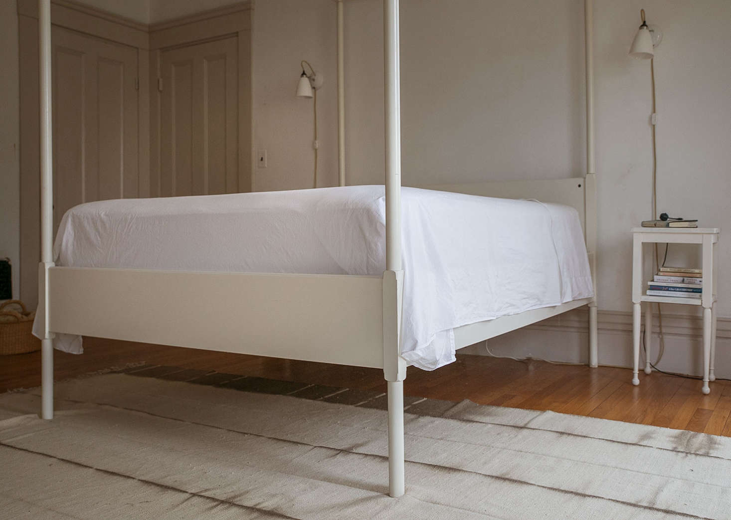 The top sheet is securely tucked in at the foot of the bed.