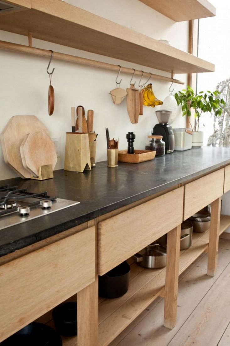 a custom oak cabinet with soapstone counters and open and closed storage anchor 18