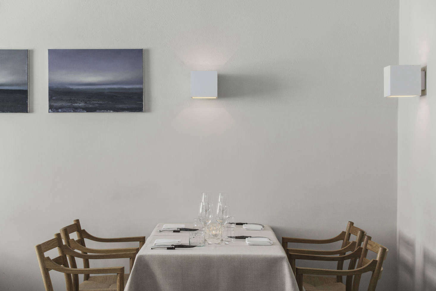 In the dining room, some tables are draped with plain tablecloths while others are left bare, giving the space a charming high-low look, despite the sophistication of the food (and the restaurant