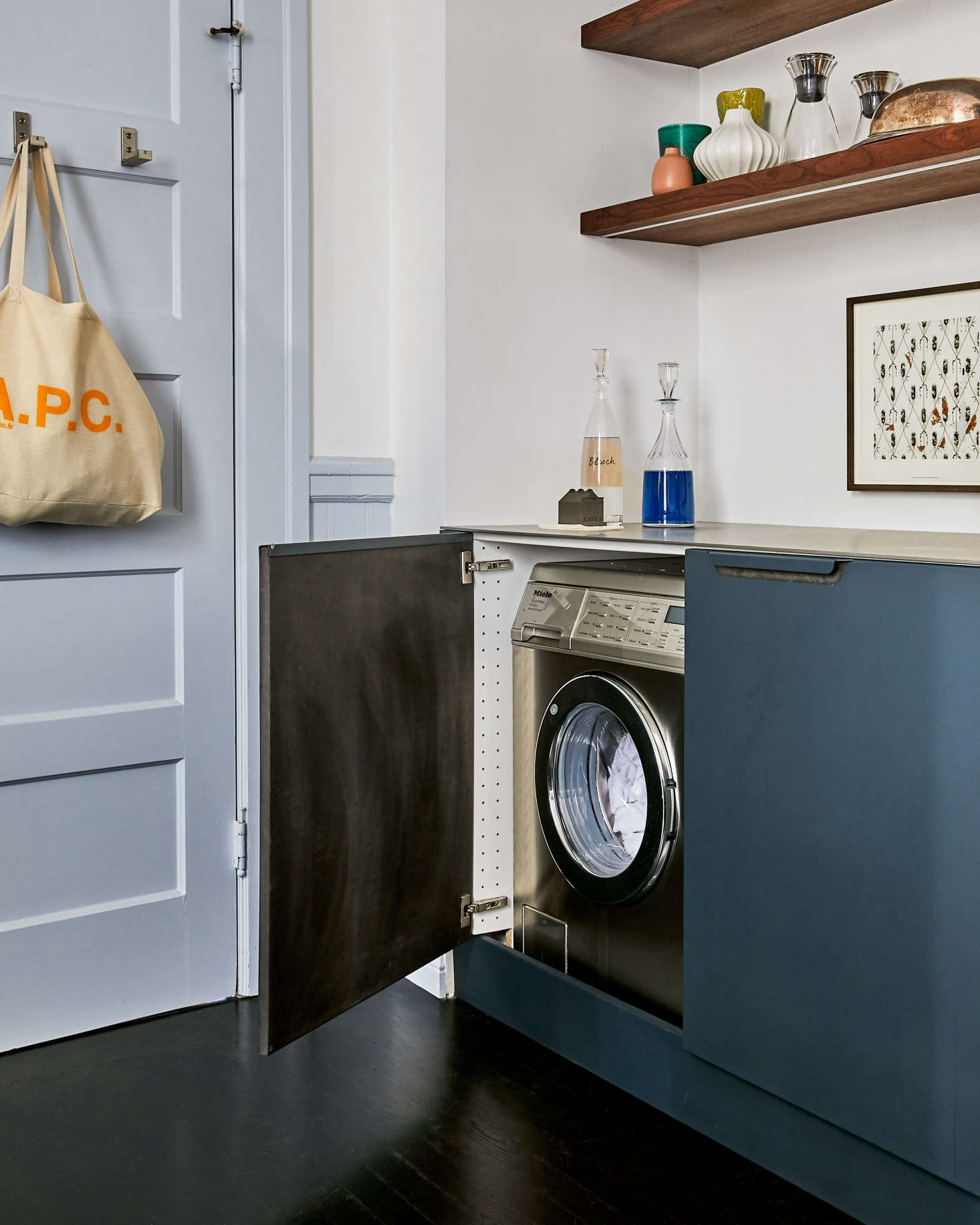 When not in use the washer and dryer disappear behind cabinet doors.
