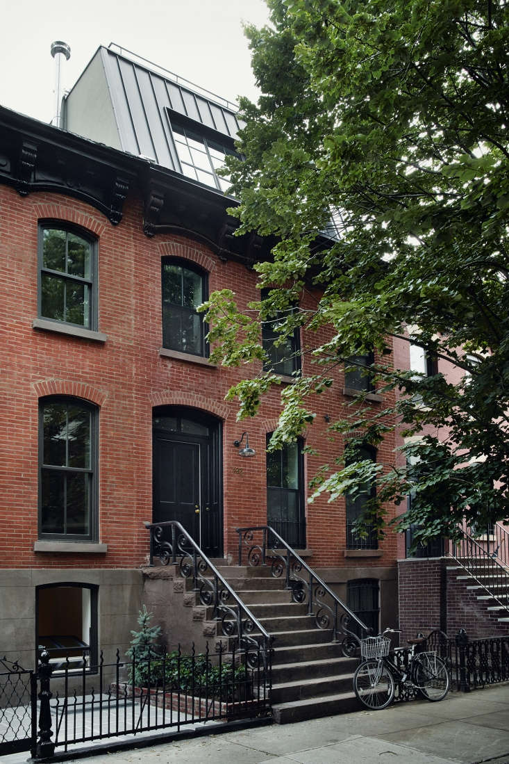 the \1905 row house has a preserved facade and its original stair and railings. 17