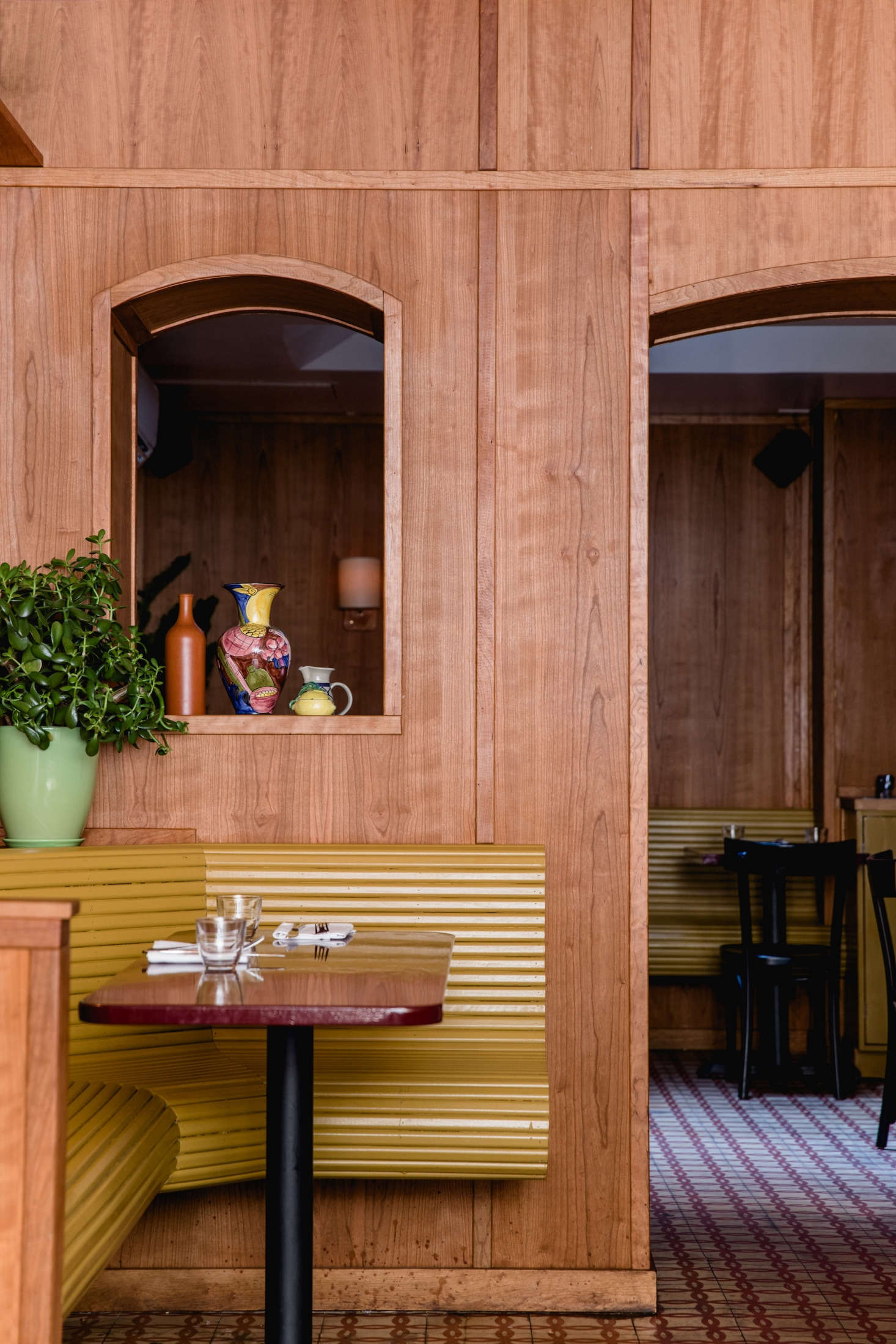 For an interior window between the front and back rooms, the team sourced vintage—and surprisingly colorful—Portuguese ceramics online.