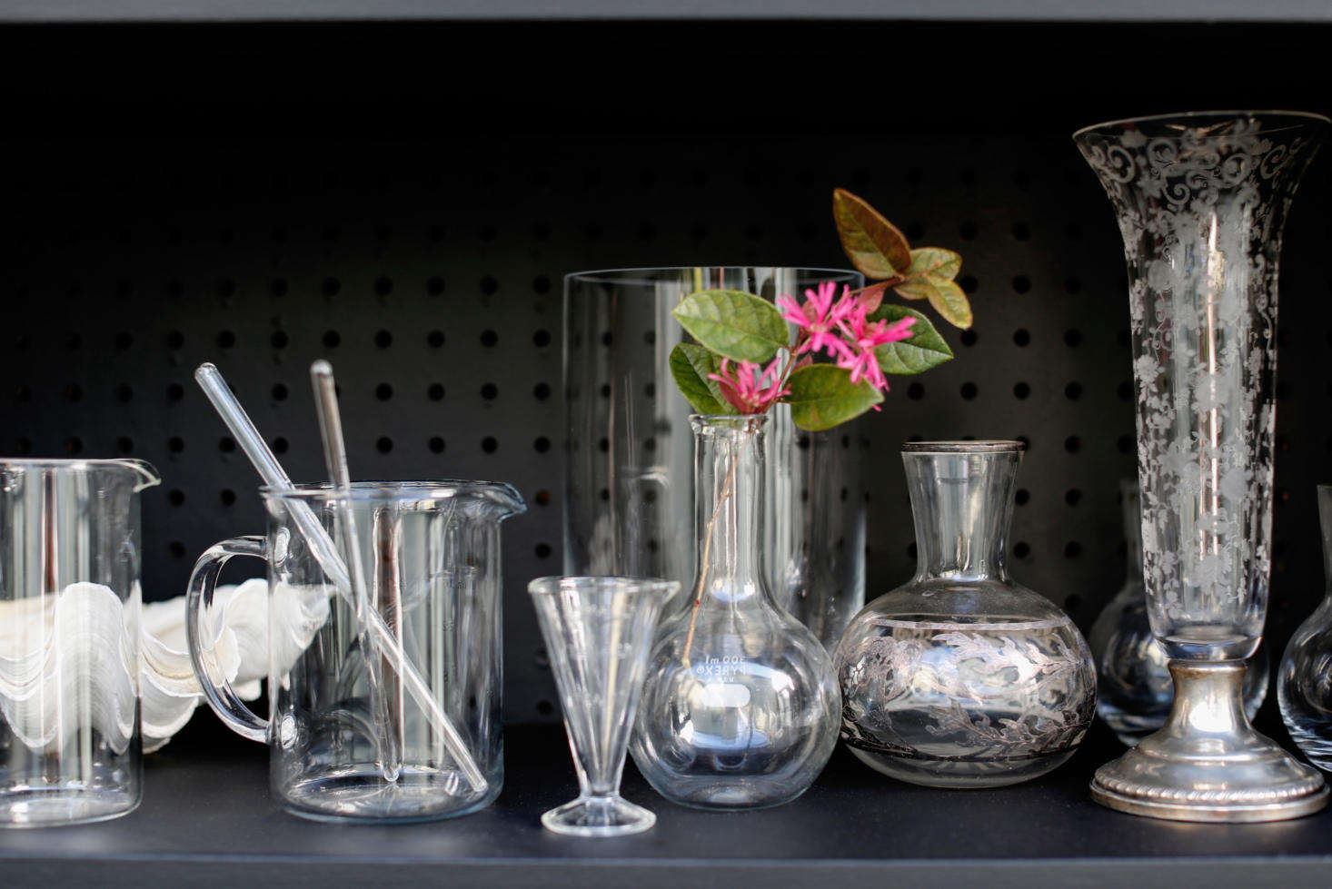 A collection of vintage glassware looks lovely against the matte black backdrop.