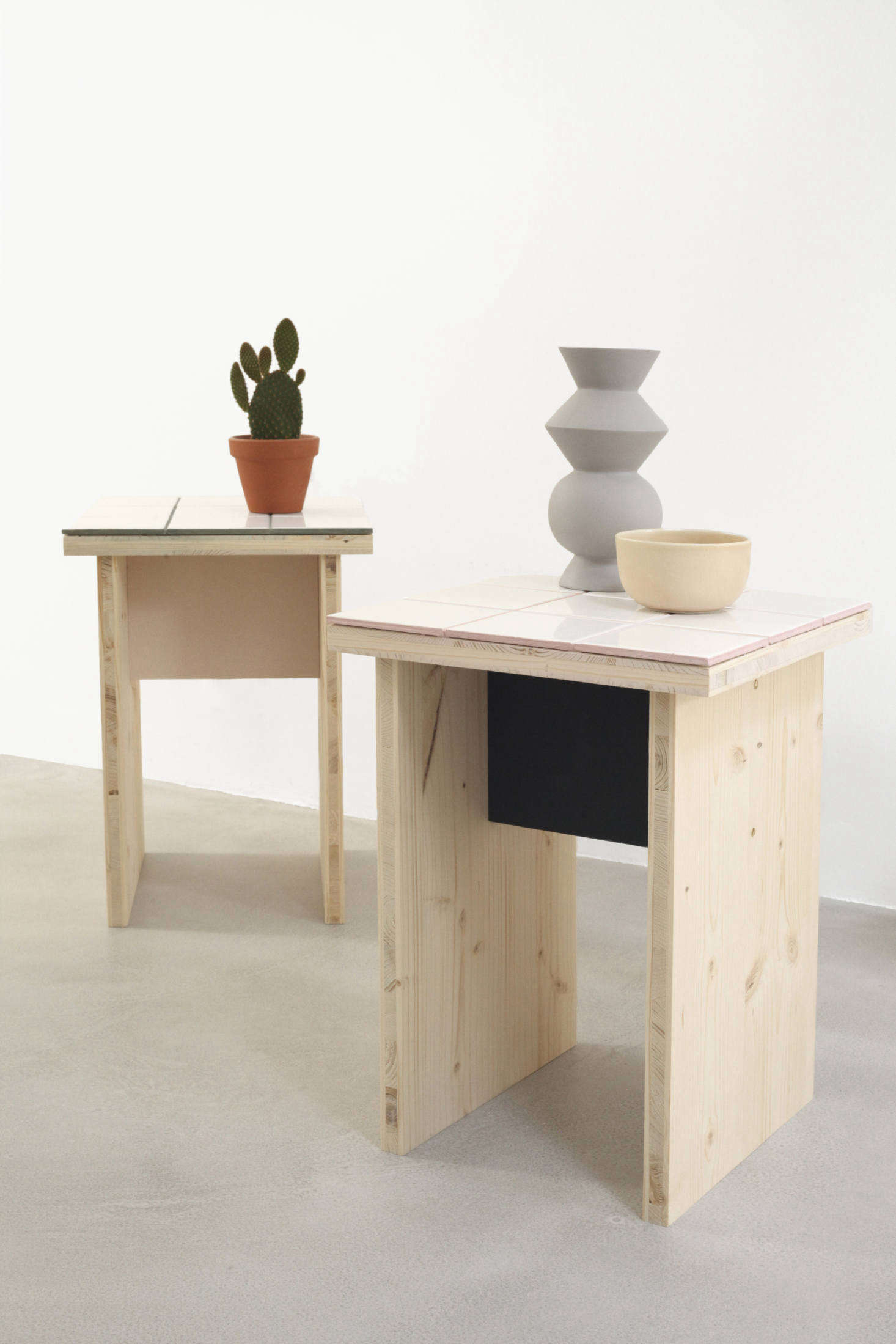 Paint and colored grout give the tables what the designers call 