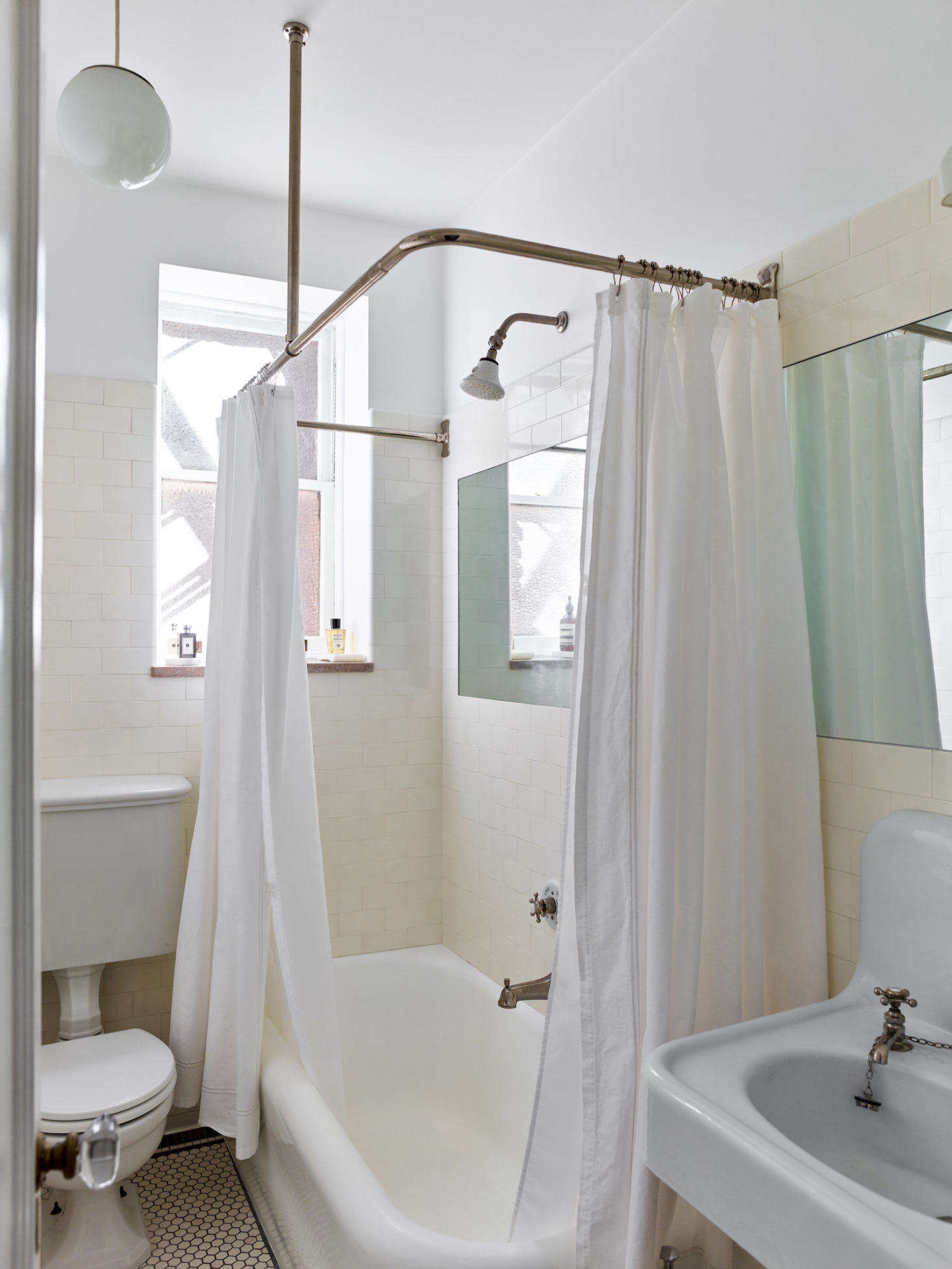 Axe hit eBay and antiques dealers to source the period-appropriate sink, toilet, and bathroom hardware. The only piece in this room that