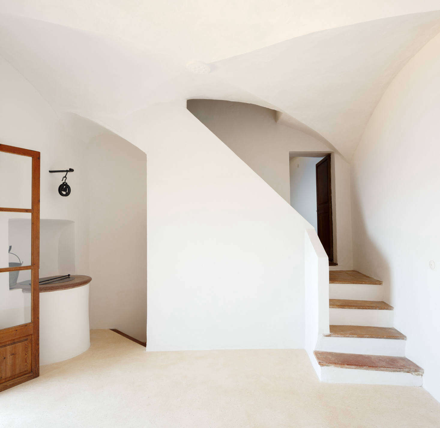 Two stairways lead to the other rooms: one bathroom, two bedrooms, a 
